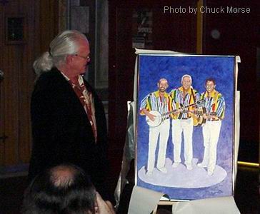 Photo of Bob Shane with painting